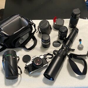 Minolta X 370 SLR Camera With Five Extra Lenses